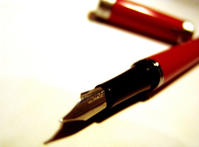 Image of an editor's red pen.