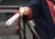 a person is giving the diploma